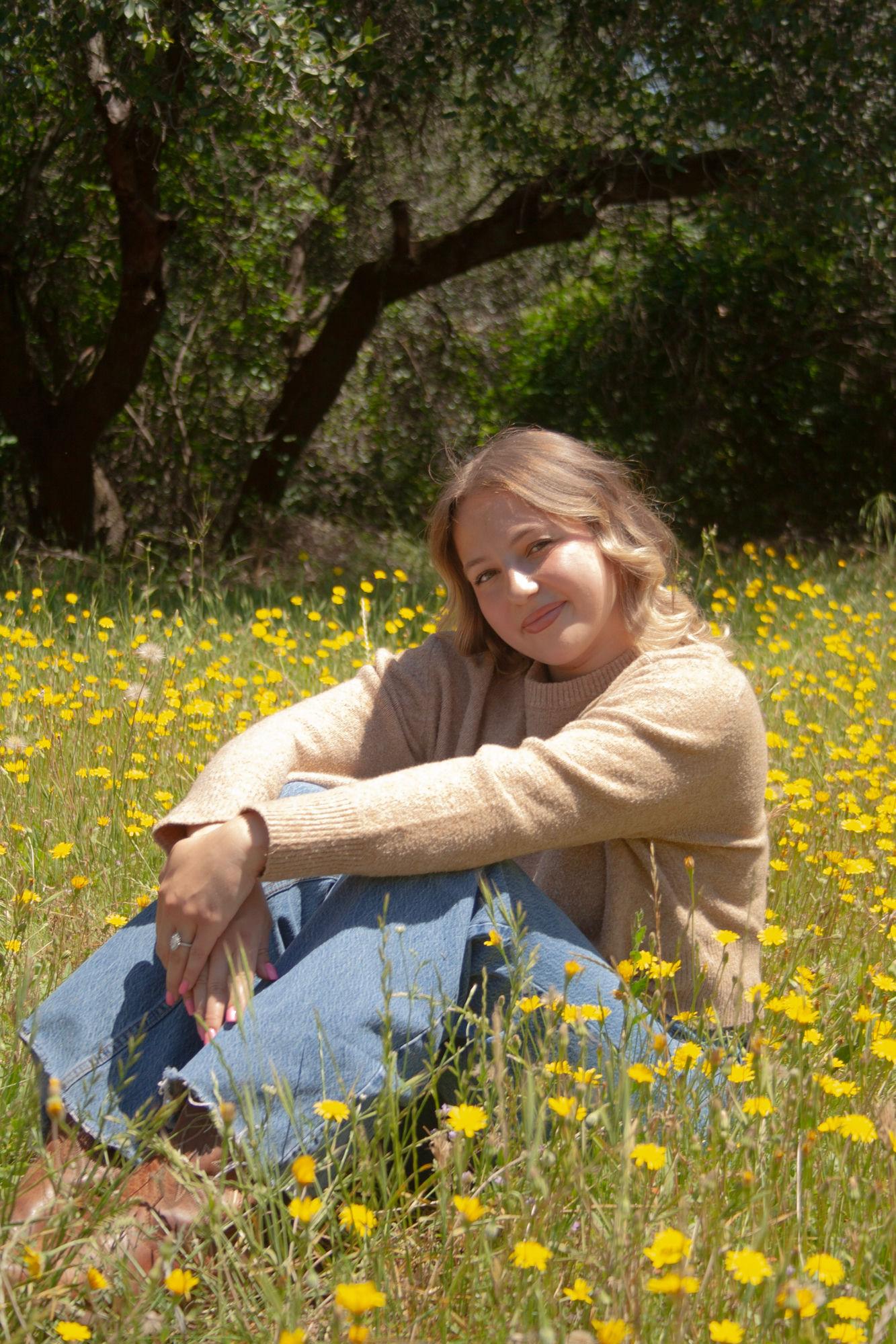 Senior graduation portrait in a wildflower field — Sacramento graduation photographer