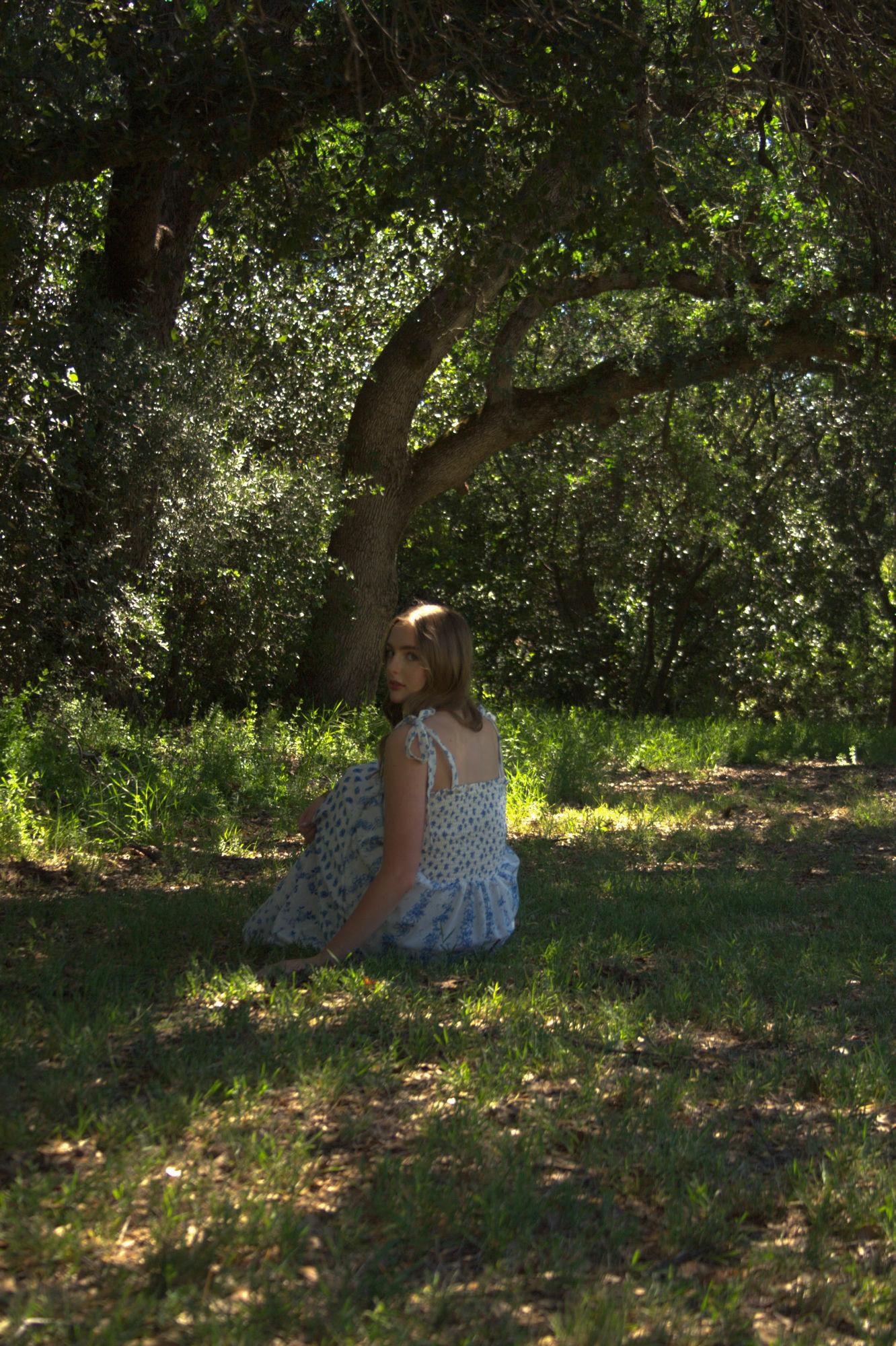 Senior portrait in a blue floral dress under an oak tree — Sacramento portrait photographer